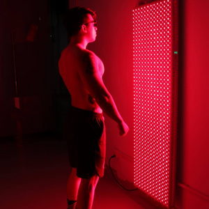 guy standing in front of PeakMe PRO3000 - Red Light Therapy Panel (Advanced Full-Body Treatment)