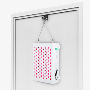 PeakMe Red Light Therapy Kit on the back of a door frame
