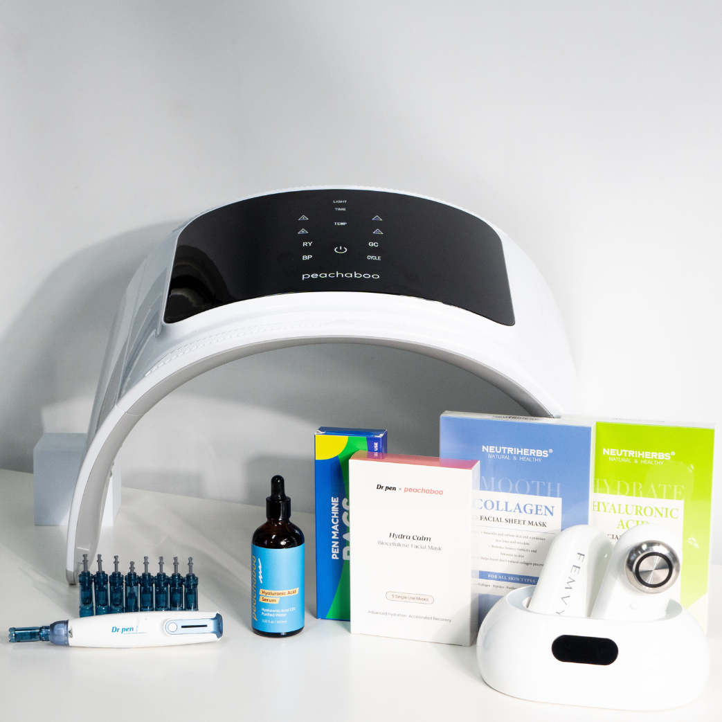 Professional bundle kit to use at-home beautifully arranged on a white surface, showcasing the Peachaboo LED Light Therapy Pod, Dr. Pen A9 microneedling device with cartridges, Peachaboo Hyaluronic Acid Serum, Peachaboo x Dr. Pen Hydra Calm Biocellulose Facial Mask, Neutriherbs Collagen and 4D Hyaluronic Acid sheet masks, and FEMVY RF skin tightening device. A complete professional skincare set designed to rejuvenate, hydrate, and enhance the skin’s natural glow.