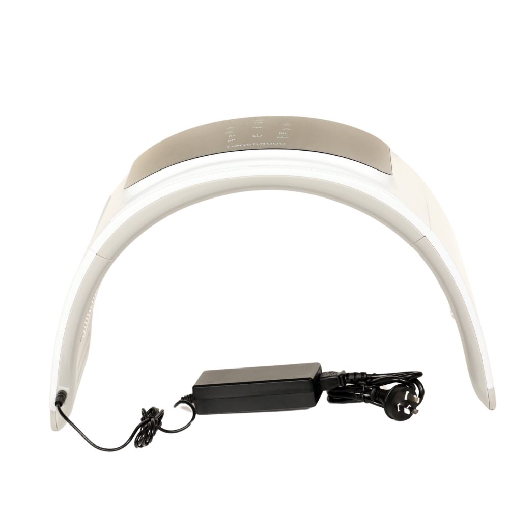 White headlamp with a power cord, designed for use with the Peachaboo LED Light Therapy Pod for effective light therapy.
