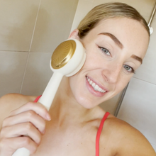 Load image into Gallery viewer, Tara using the Zobelle Sonica Silicone Body Brush
