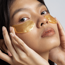 Load image into Gallery viewer, Close up photo of a woman using Femvy Gold Collagen Eye Mask 