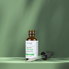 Load image into Gallery viewer, tea tree clear skin super serum 30ml with an open bottle