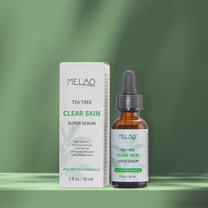 a bottle of tea tree clear skin super serum 30ml with a box