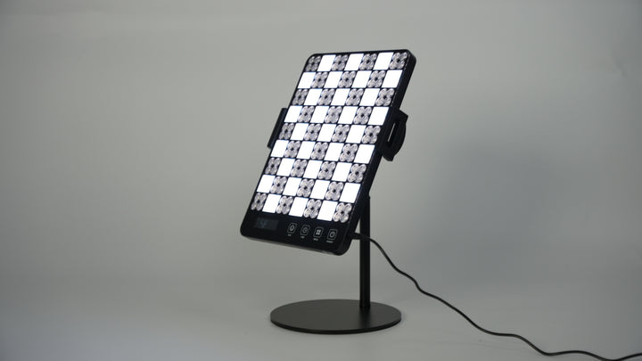  LED facial treatment lamp featuring a grid of lights for enhanced skincare and rejuvenation.