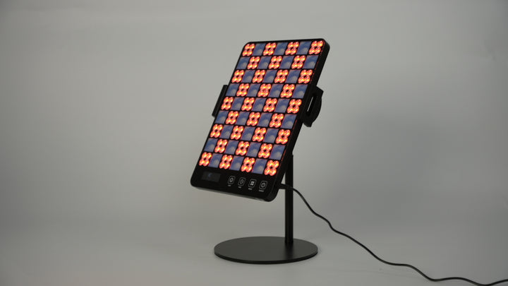 A striking red and orange screen, representing the LED Facial Treatment Lamp technology.