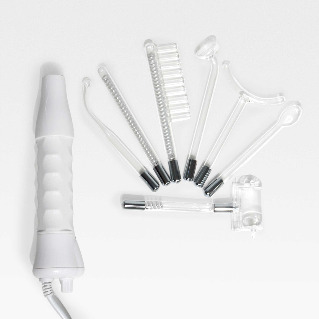 Peachaboo High-Frequency Therapy Wand with 7  electrode attachments displayed beside it.