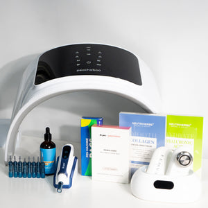 A display of microneedling pen, skincare, and beauty devices including a white Peachaboo LED Light Therapy Pod positioned at the back, a Dr. Pen A11 microneedling device with cartridges on the left, a bottle of Peachaboo Hyaluronic Acid Serum, a box of Peachaboo x Dr. Pen Hydra Calm Biocellulose Facial Masks, Neutriherbs collagen and hyaluronic acid facial masks, and a Femvy skin tightening device on its charging base. All items are neatly arranged on a white surface.