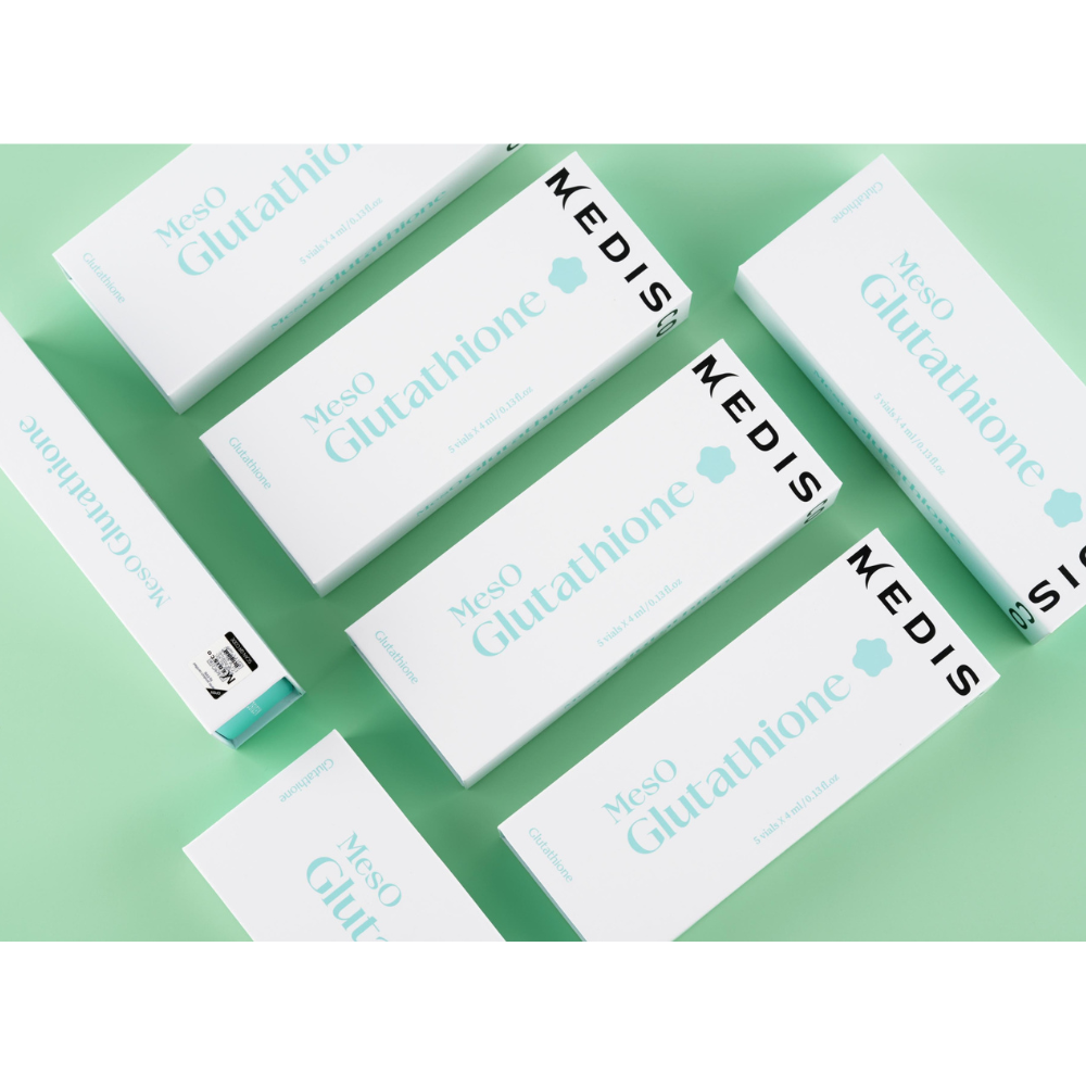 Flatlay of Medisco MesO Glutathione Ampoule packaging arranged on a mint green background.