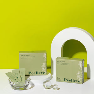 Medisco Peelieve Cica Cream boxes and pouches on a white surface with a green
