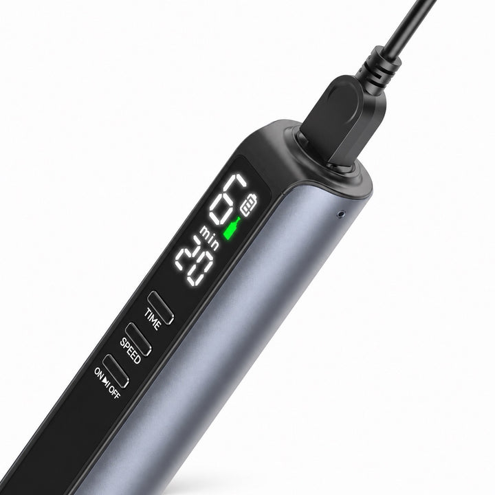 Close up to tip of Dr. Pen M8 Max Microneedling Pen connected to charging cable