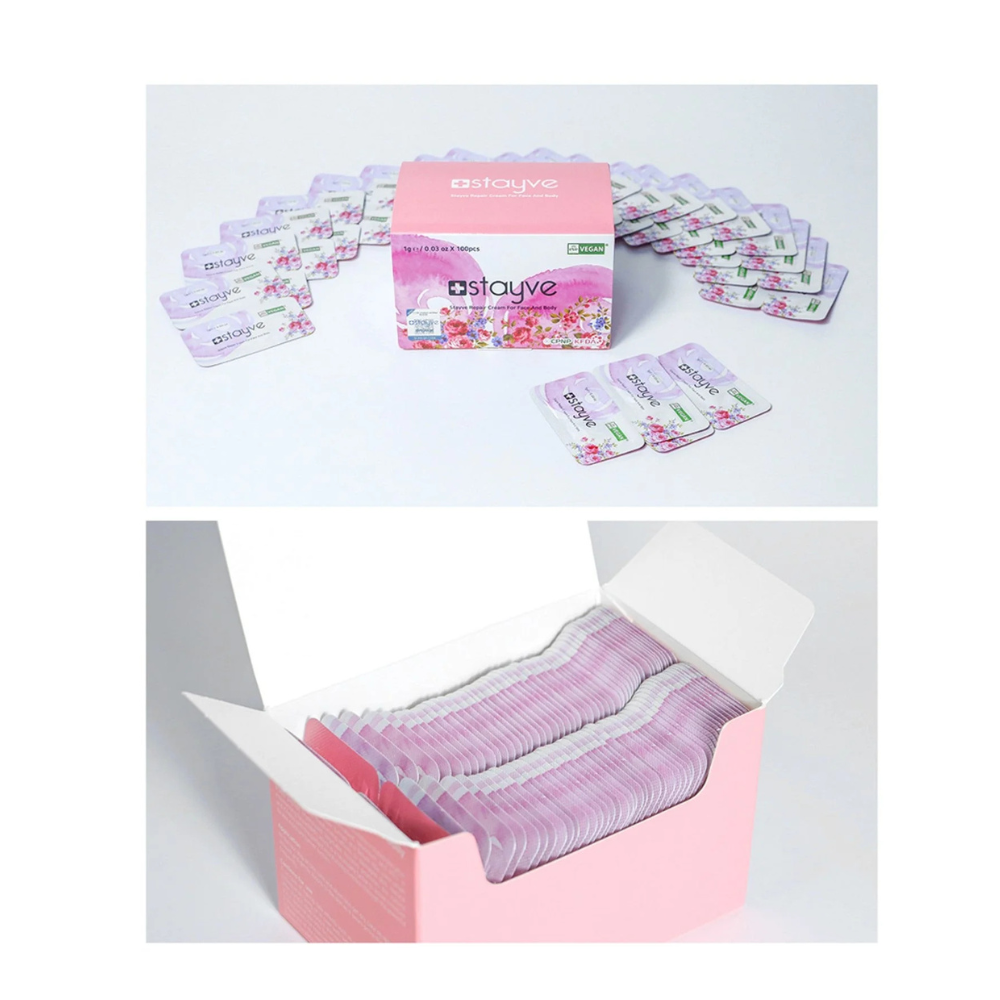 Stayve Repair Cream For Face And Body box with sachets around the packaging, and neatly stacked inside an open box.