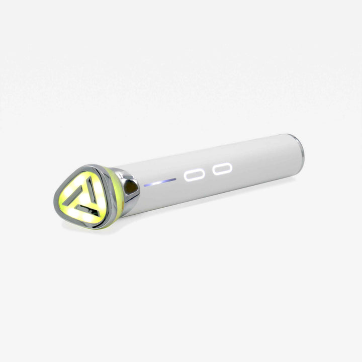  An elegant white and yellow electronic beauty wand adorned with a vibrant yellow triangle, showcasing contemporary design and sophistication.