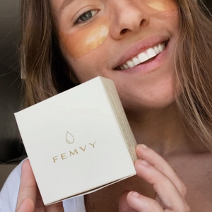 a woman using and showing femvy gold collagen eye mask
