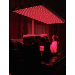 a man using Horizontal Stand for PeakMe Red Light Therapy Panel 