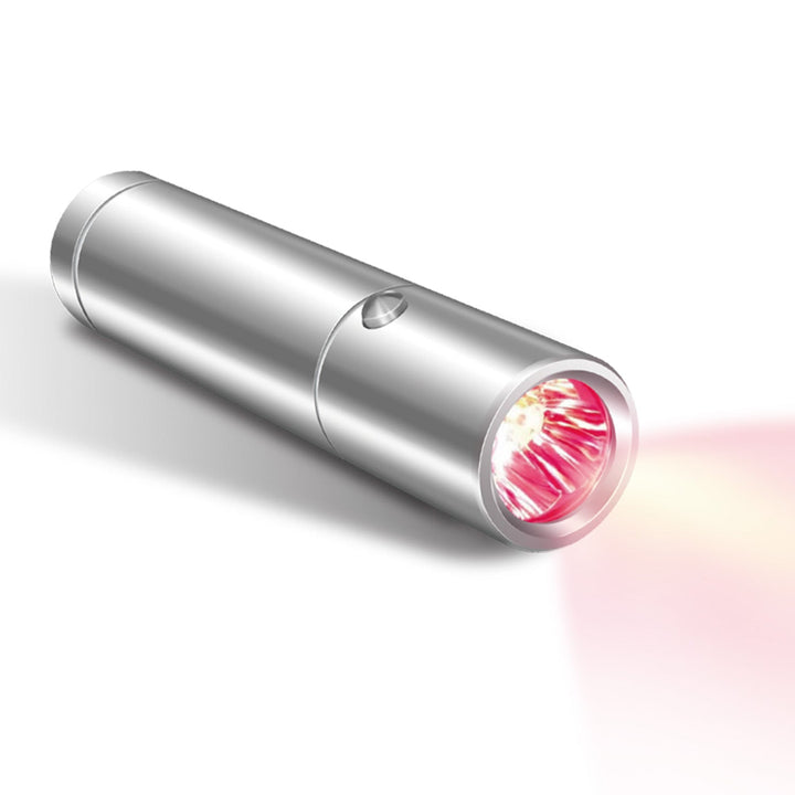 Handheld multi-wavelength red light therapy torch with silver aluminium body and illuminated red light head.