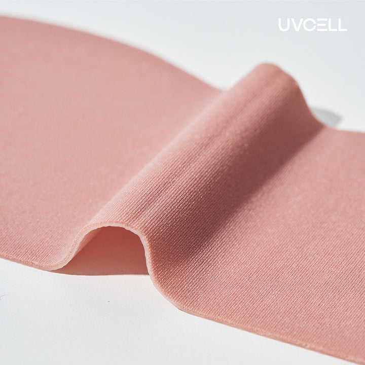 Macro view of the soft, textured material used in the UVCELL Super Collagen V-Lifting Mask.