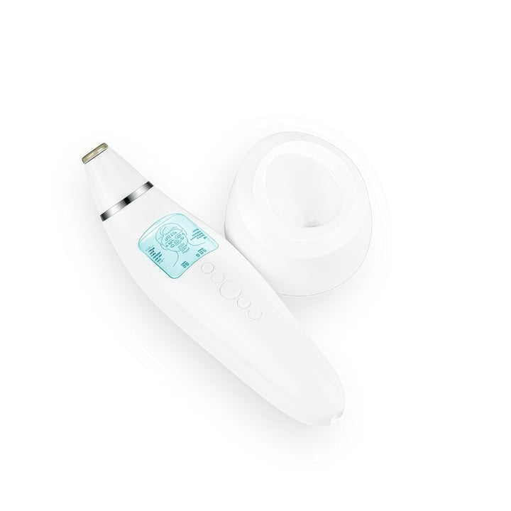 Diamond microdermabrasion pore vacuum device with charging base shown from angled top view