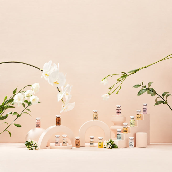 Display of small Stayve vials with flowers on a light peach background. Capacity 8ml x 10 vial per box.