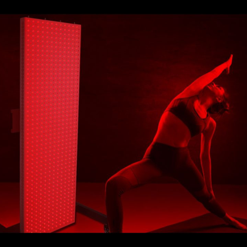 a woman using Vertical Stand for PeakMe Red Light Therapy Panel