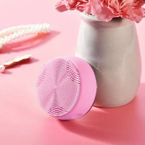 Facial Cleansing Brush with EMS & LED Light Therapy with a vase