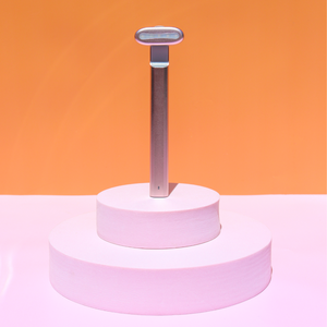 The 4-in-1 LED Facial Wand in a pink stage