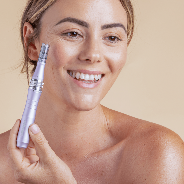 a woman using zobelle maxima microneeding pen