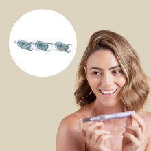 Load image into Gallery viewer, a woman holding zobelle maxima microneedling pen with nano cartridge